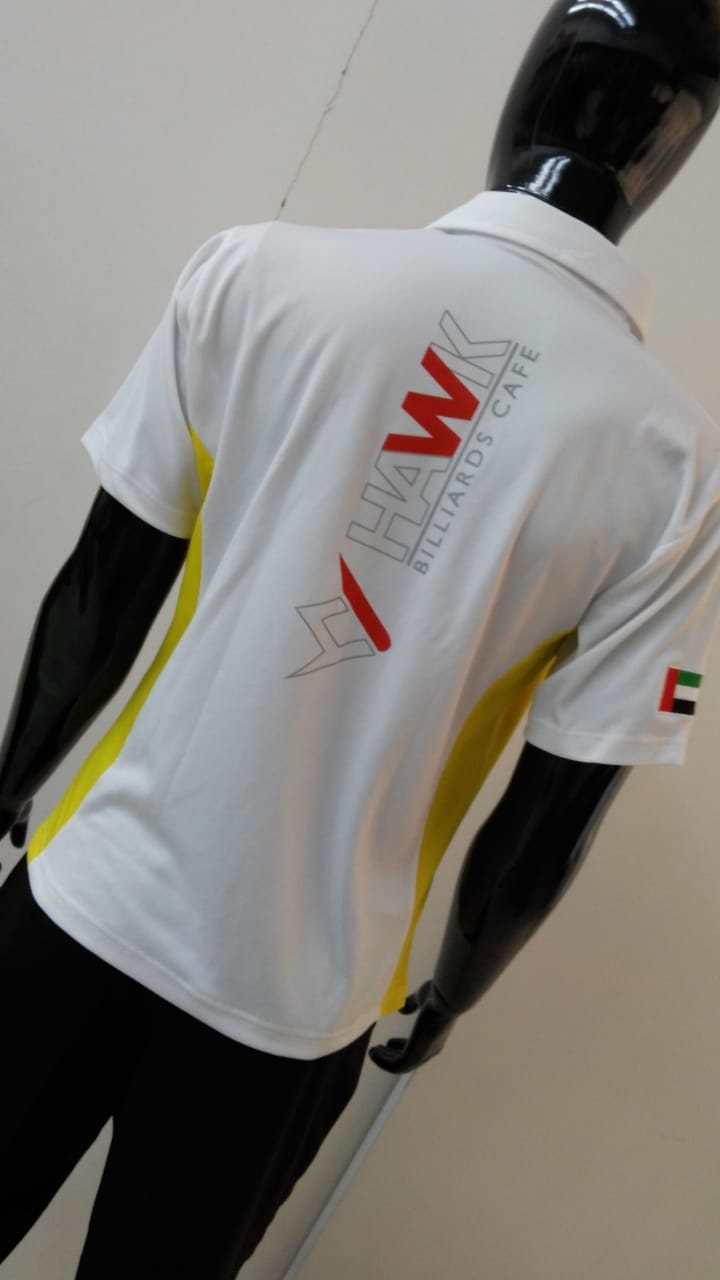 White sports shirt with yellow side panels and printed lettering on a mannequin