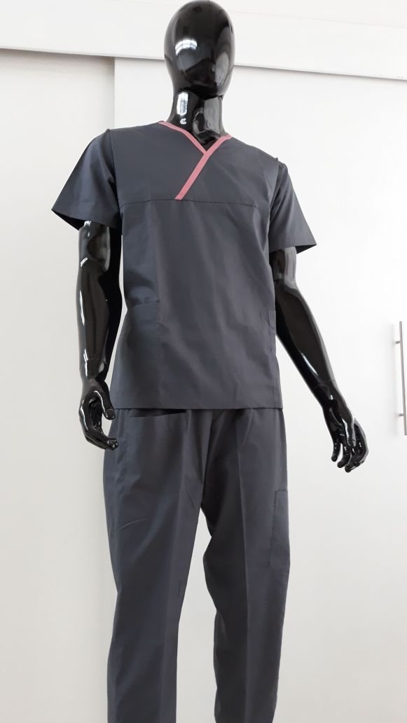 Charcoal-grey medical scrubs with a contrast V-neck trim on a mannequin