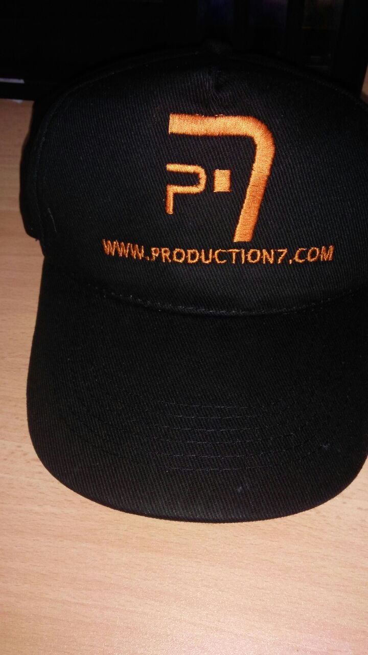 Black baseball cap with a printed orange 'P7' logo and web address