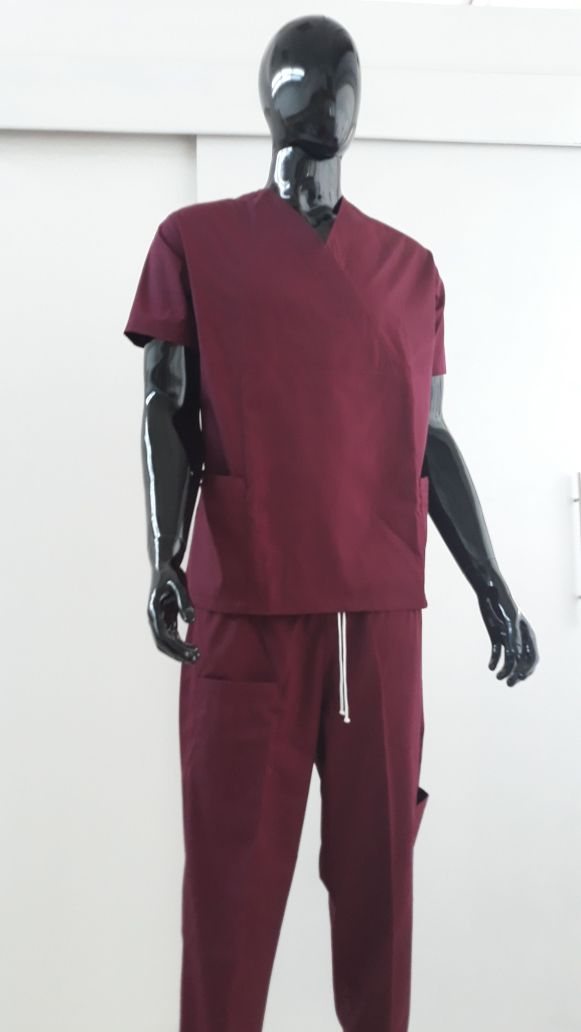 Maroon two-piece medical scrubs (V-neck top and trousers) on a mannequin