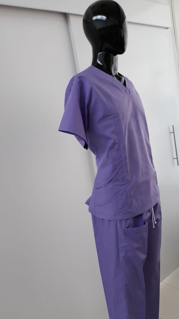 Lavender-purple medical scrubs on a mannequin